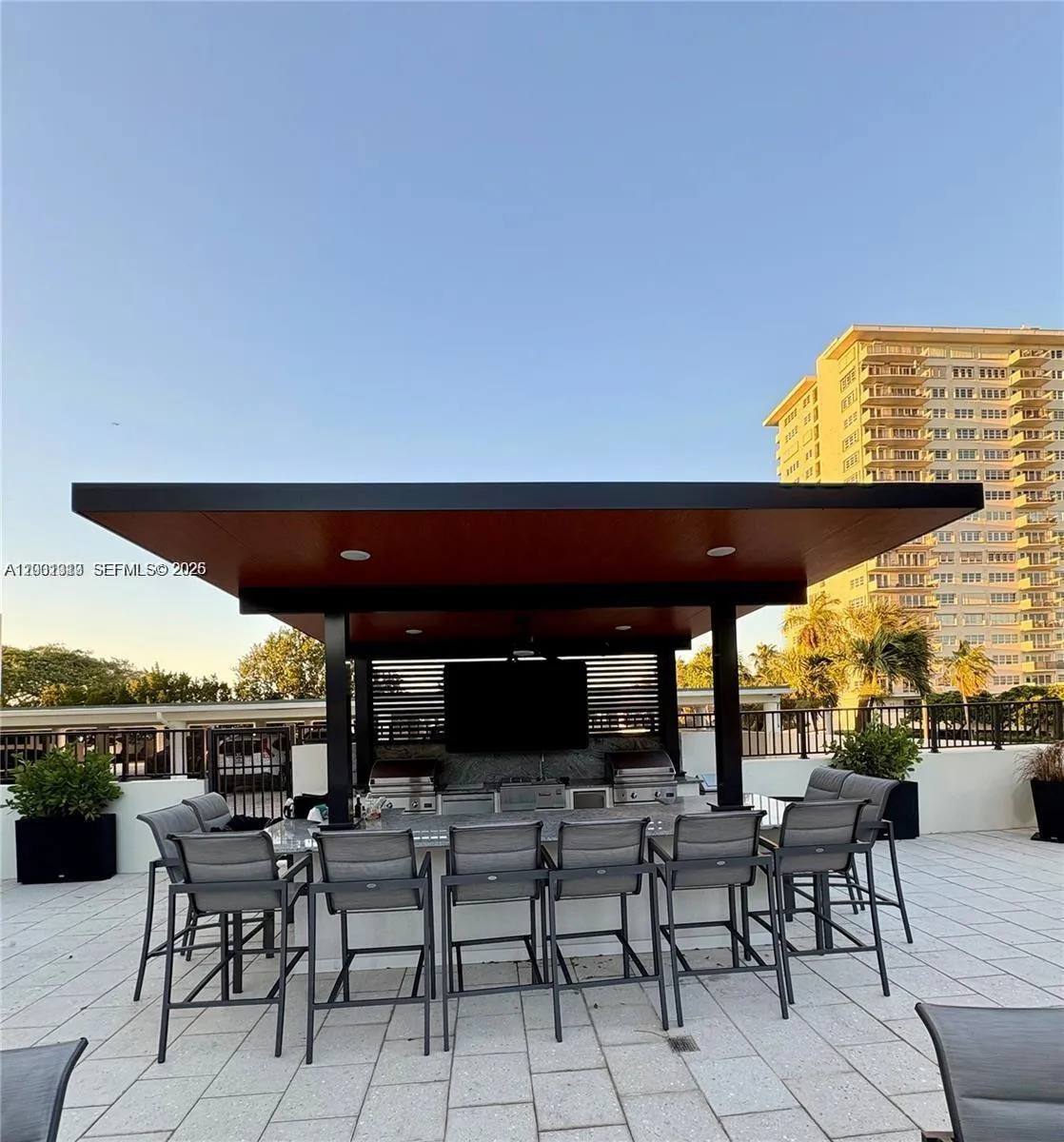 Covered pergola with BBQs and TV