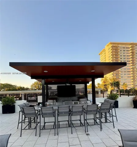 Covered pergola with BBQs and TV