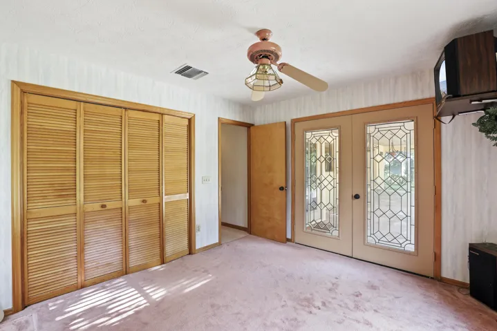 Third bedroom or make this your office. French doors that bring you out to the pool.