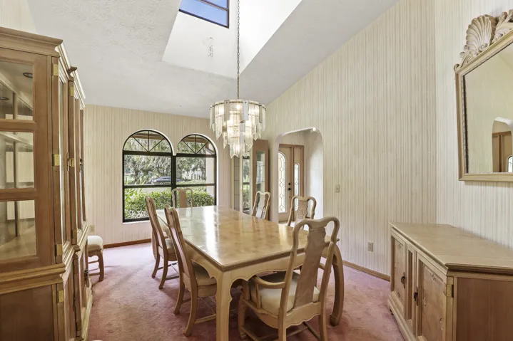 Elegant dining room abundant natural light.