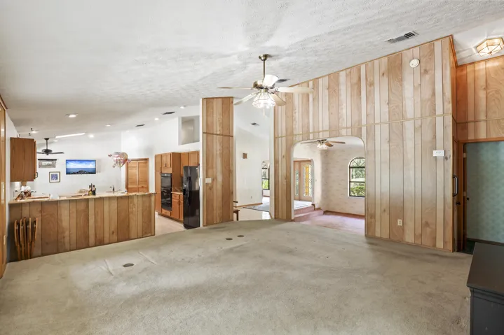 Family room off the Kitchen. Cathedral ceiling with natural light.