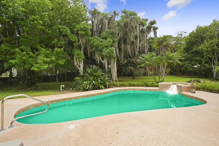 Stunning outdoor living space expansive poolside.