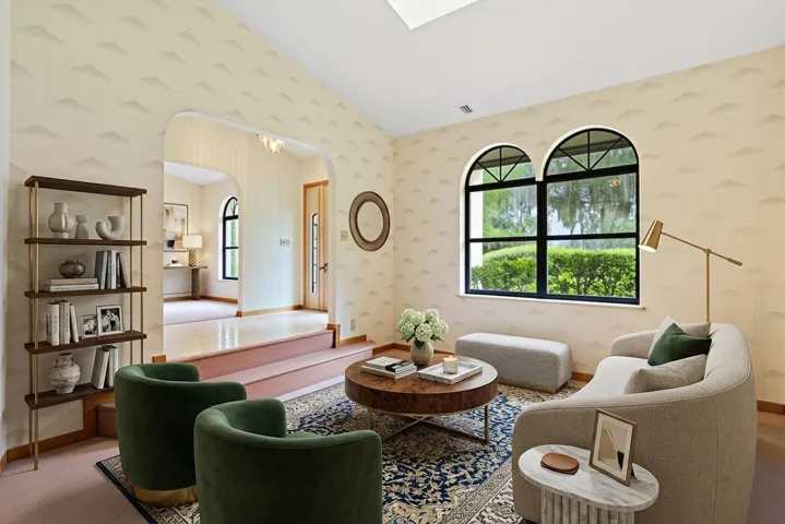 Virually Staged Formal living flanks main foyer. Palladian windows add light and connection to the outdoors.