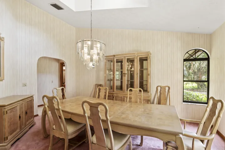 Spacious dining room filled with natural light.