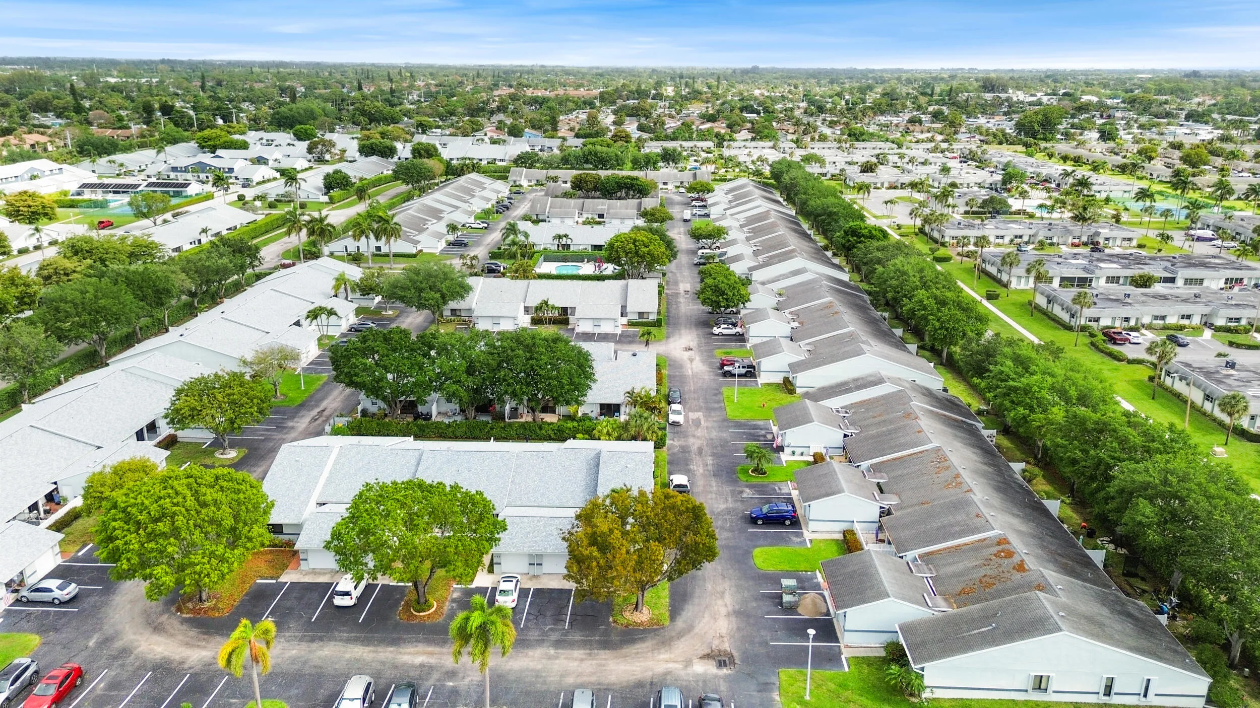 Beautifully maintained and thoughtfully laid out, this charming community offers a peaceful residential setting with lush landscaping, mature trees, and a welcoming neighborhood feel. From above, you can truly appreciate the spacious layout, ample parking, and the blend of privacy and connectivity that makes this location so desirable. Ideally located in West Palm Beach, you’ll enjoy a serene environment while remaining close to shopping, dining, major roadways, and all the conveniences of South Florida living.