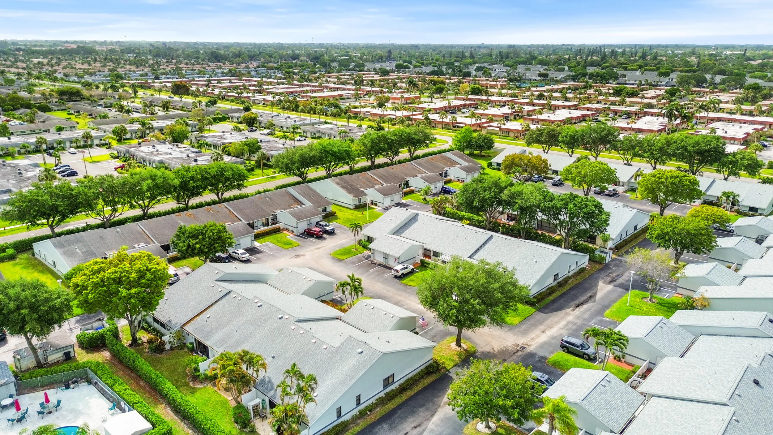 Beautifully maintained and thoughtfully laid out, this charming community offers a peaceful residential setting with lush landscaping, mature trees, and a welcoming neighborhood feel. From above, you can truly appreciate the spacious layout, ample parking, and the blend of privacy and connectivity that makes this location so desirable. Ideally located in West Palm Beach, you’ll enjoy a serene environment while remaining close to shopping, dining, major roadways, and all the conveniences of South Florida living.