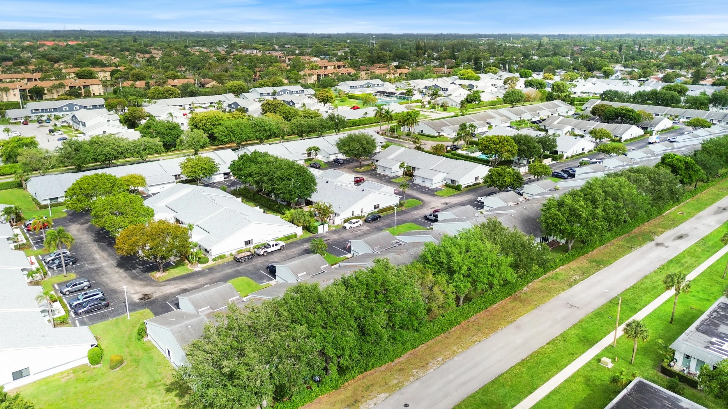 Beautifully maintained and thoughtfully laid out, this charming community offers a peaceful residential setting with lush landscaping, mature trees, and a welcoming neighborhood feel. From above, you can truly appreciate the spacious layout, ample parking, and the blend of privacy and connectivity that makes this location so desirable. Ideally located in West Palm Beach, you’ll enjoy a serene environment while remaining close to shopping, dining, major roadways, and all the conveniences of South Florida living.
