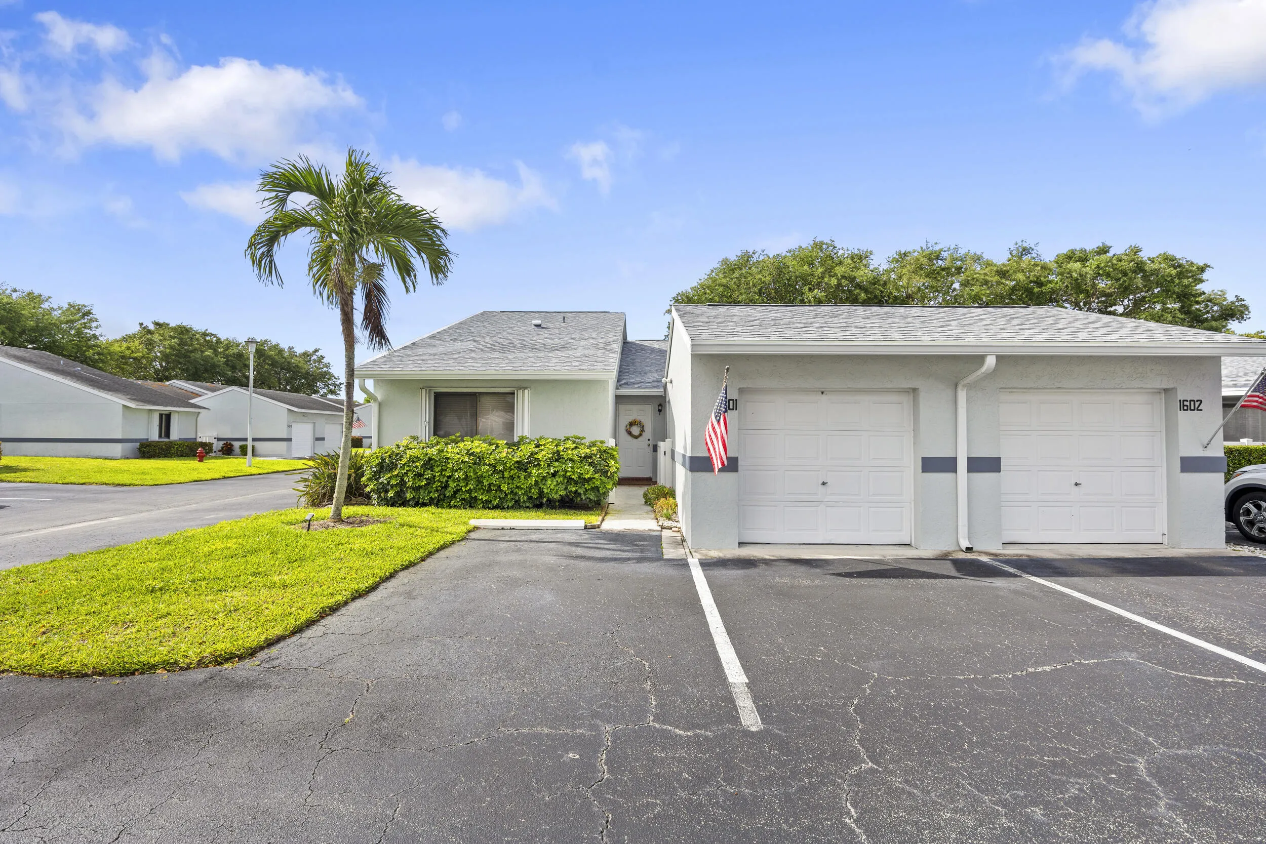 Charming 2/2 villa with a clean, well-maintained exterior, surrounded by lush landscaping and a welcoming approach that sets the tone from the moment you arrive.