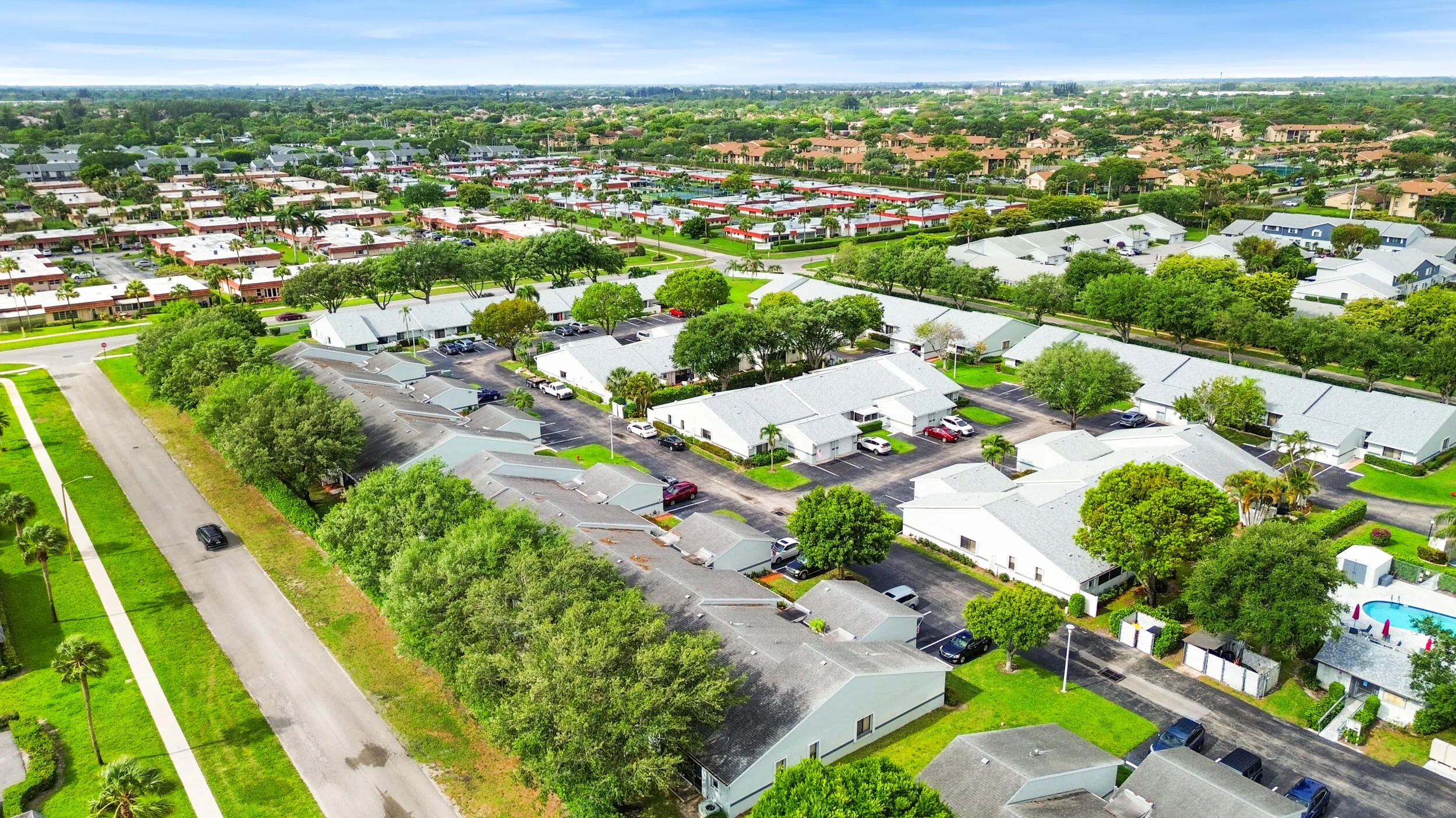 Beautifully maintained and thoughtfully laid out, this charming community offers a peaceful residential setting with lush landscaping, mature trees, and a welcoming neighborhood feel. From above, you can truly appreciate the spacious layout, ample parking, and the blend of privacy and connectivity that makes this location so desirable. Ideally located in West Palm Beach, you’ll enjoy a serene environment while remaining close to shopping, dining, major roadways, and all the conveniences of South Florida living.