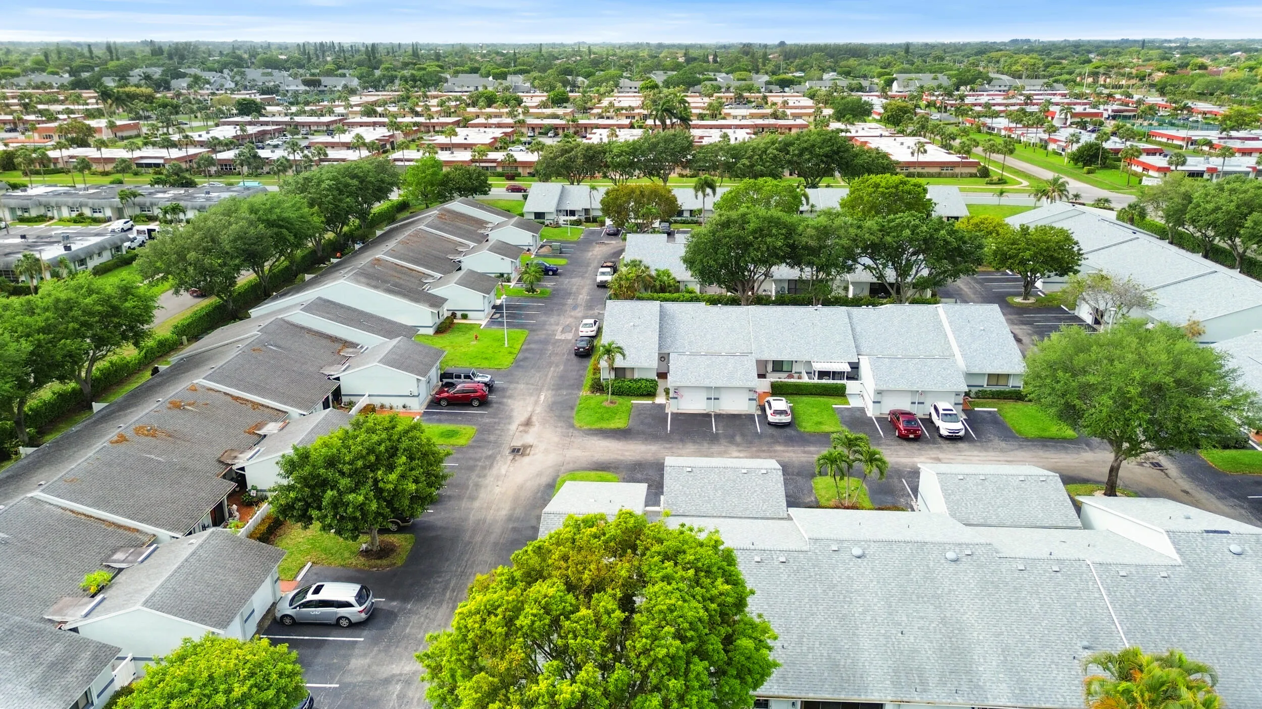 Beautifully maintained and thoughtfully laid out, this charming community offers a peaceful residential setting with lush landscaping, mature trees, and a welcoming neighborhood feel. From above, you can truly appreciate the spacious layout, ample parking, and the blend of privacy and connectivity that makes this location so desirable. Ideally located in West Palm Beach, you’ll enjoy a serene environment while remaining close to shopping, dining, major roadways, and all the conveniences of South Florida living.