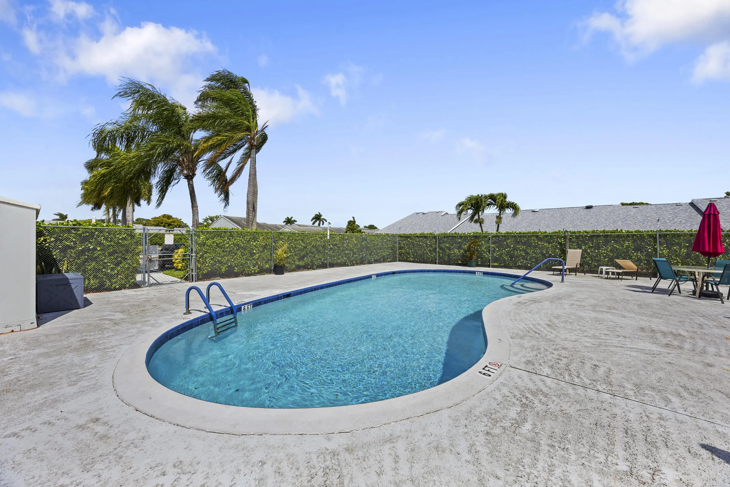 Enjoy resort-style living with this spacious community pool just steps away, offering plenty of room for lounging, soaking up the sun, and relaxing with friends and neighbors. Surrounded by ample seating and shaded areas, it’s the perfect spot to unwind and enjoy the South Florida lifestyle.