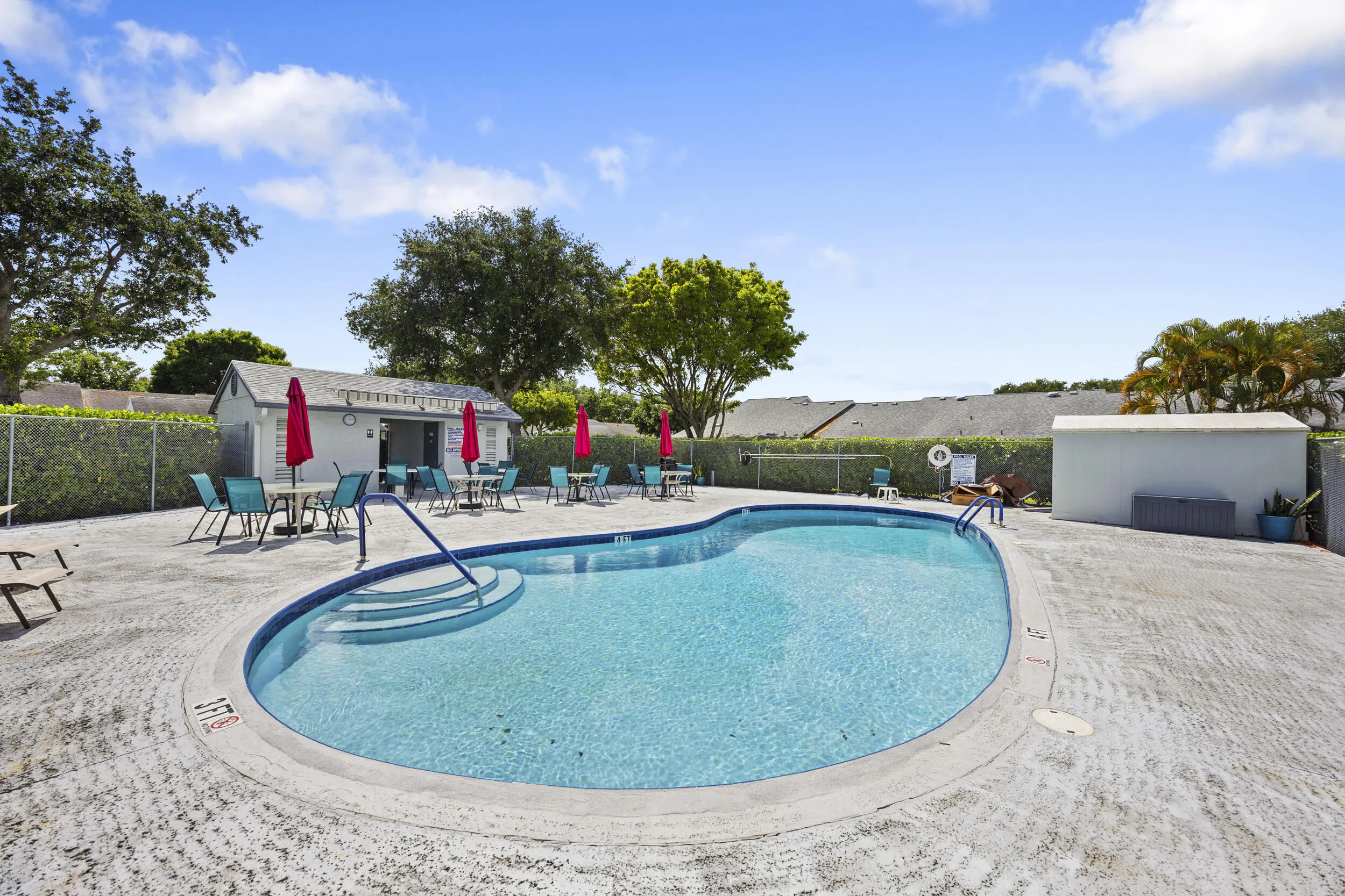 Enjoy resort-style living with this spacious community pool just steps away, offering plenty of room for lounging, soaking up the sun, and relaxing with friends and neighbors. Surrounded by ample seating and shaded areas, it’s the perfect spot to unwind and enjoy the South Florida lifestyle.