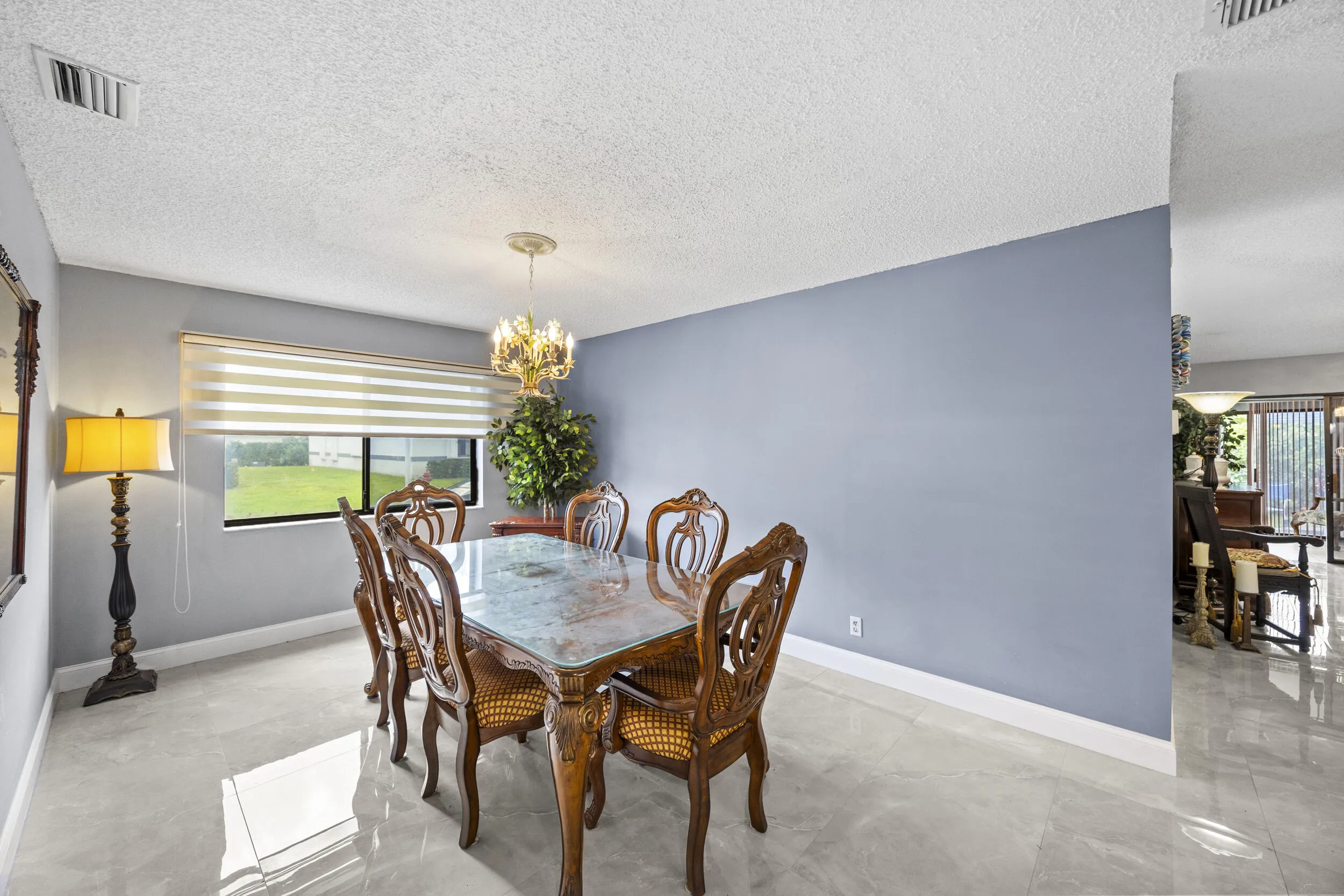 Spacious dining area with an open feel, offering plenty of room for gatherings and seamlessly connecting to the main living spaces for easy everyday living and entertaining.