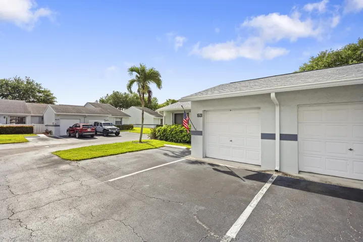 Charming 2/2 villa with a clean, well-maintained exterior, surrounded by lush landscaping and a welcoming approach that sets the tone from the moment you arrive.