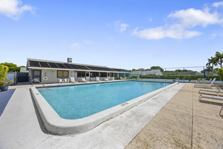 In addition to the nearby pool, enjoy access to a larger clubhouse pool designed for both relaxation and recreation. With expansive deck space, lounge seating, and a welcoming atmosphere, it’s the perfect setting to soak up the sun, take a refreshing swim, or spend the day enjoying the best of South Florida living.