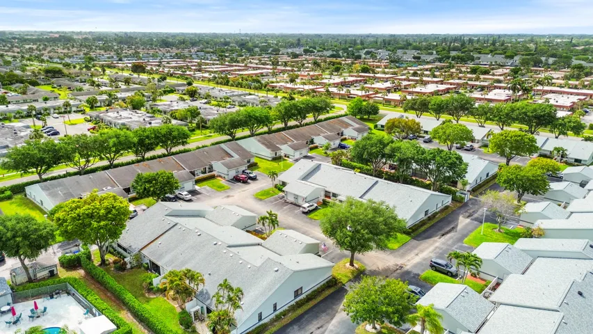 Beautifully maintained and thoughtfully laid out, this charming community offers a peaceful residential setting with lush landscaping, mature trees, and a welcoming neighborhood feel. From above, you can truly appreciate the spacious layout, ample parking, and the blend of privacy and connectivity that makes this location so desirable. Ideally located in West Palm Beach, you’ll enjoy a serene environment while remaining close to shopping, dining, major roadways, and all the conveniences of South Florida living.