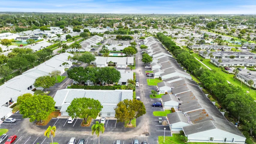Beautifully maintained and thoughtfully laid out, this charming community offers a peaceful residential setting with lush landscaping, mature trees, and a welcoming neighborhood feel. From above, you can truly appreciate the spacious layout, ample parking, and the blend of privacy and connectivity that makes this location so desirable. Ideally located in West Palm Beach, you’ll enjoy a serene environment while remaining close to shopping, dining, major roadways, and all the conveniences of South Florida living.