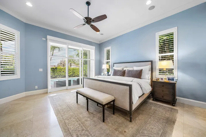 Primary Suite has sliding glass doors out to the pool.