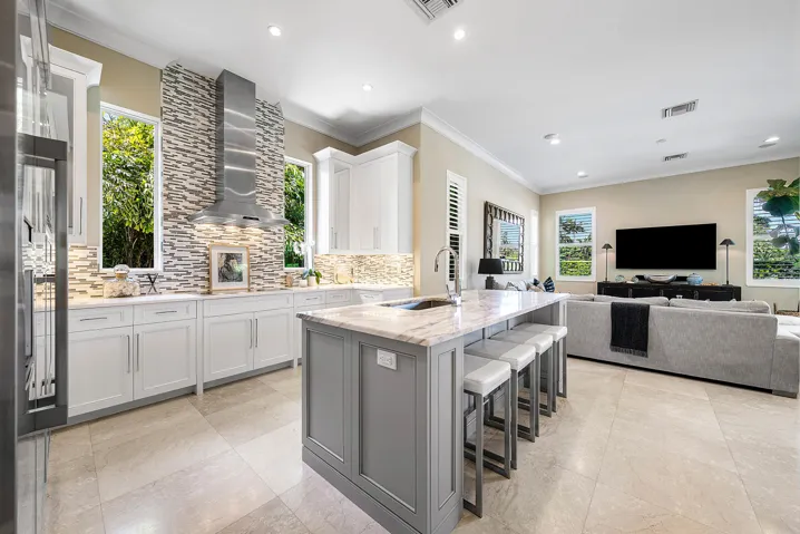 Light & bright kitchen with Thermador appliances and tall windows allowing in lots of natural light.