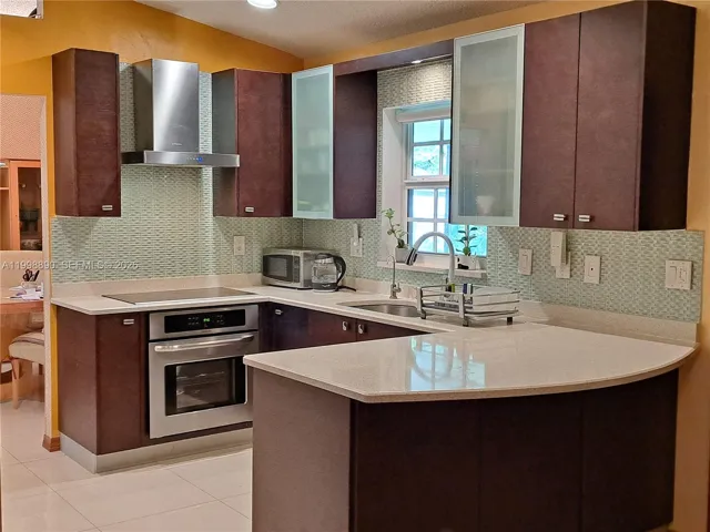 European style kitchen with glass back splash