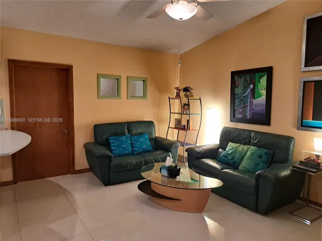 Vaulted ceiling family room with ceiling fan