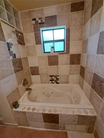 Mater Bathroom with Jacuzzi and impact window