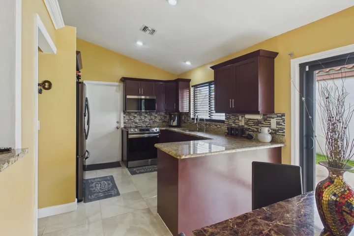 Kitchen with stainless steel appliances and granite countertops