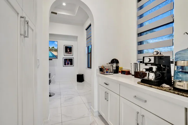 Coffee area with oversized pantry.