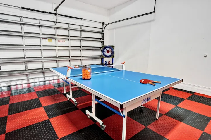Garage has interlocking tile floors.
