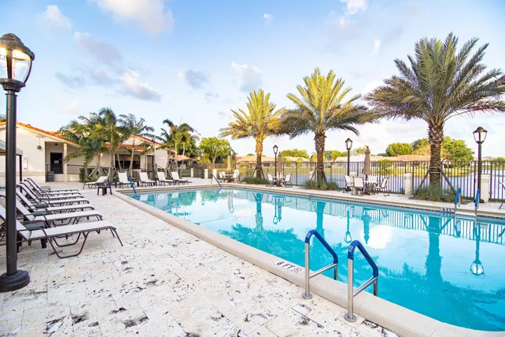 MAIN COMMUNITY POOL WITH SEPARATE JACUZZI ON THE LAKE NEXT TO FANTASTIC CLUBHOUSE WITH KITCHEN, GYM AND SITTING AREA