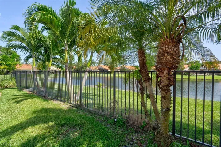 VIEW FROM THE BACK YARD FENCE TO LAKE