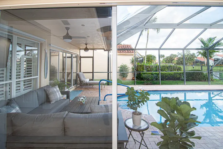 Looking from Master Bedroom Sliding glass door to screened in pool area.