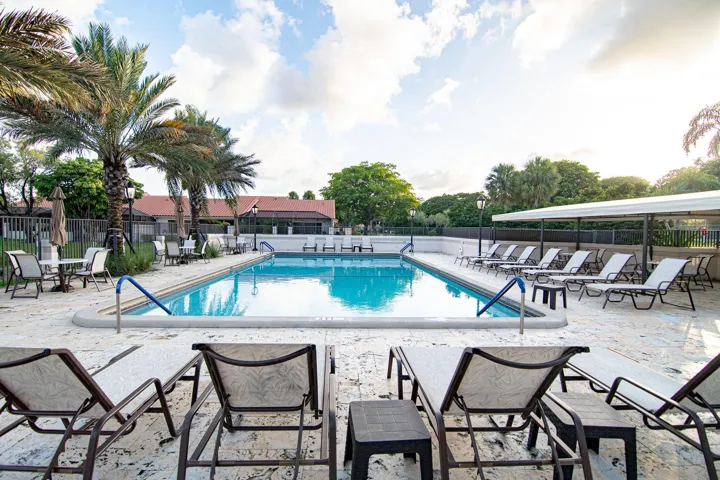 MAIN COMMUNITY POOL WITH SEPARATE JACUZZI ON THE LAKE NEXT TO FANTASTIC CLUBHOUSE WITH KITCHEN, GYM AND SITTING AREA