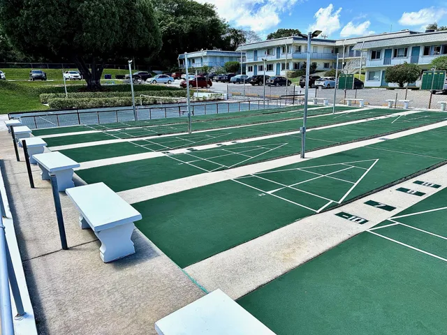 Shuffleboard courts with pickleball in the background