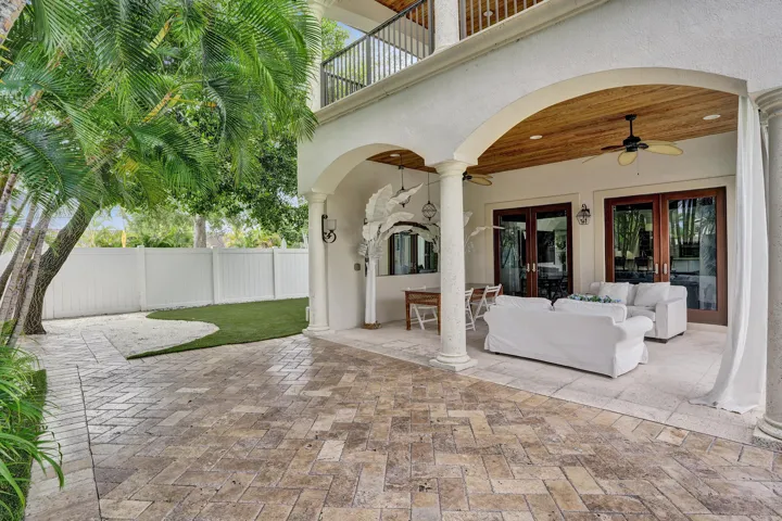 Large covered porch off the Family room. Above is the private covered deck of the Master suite