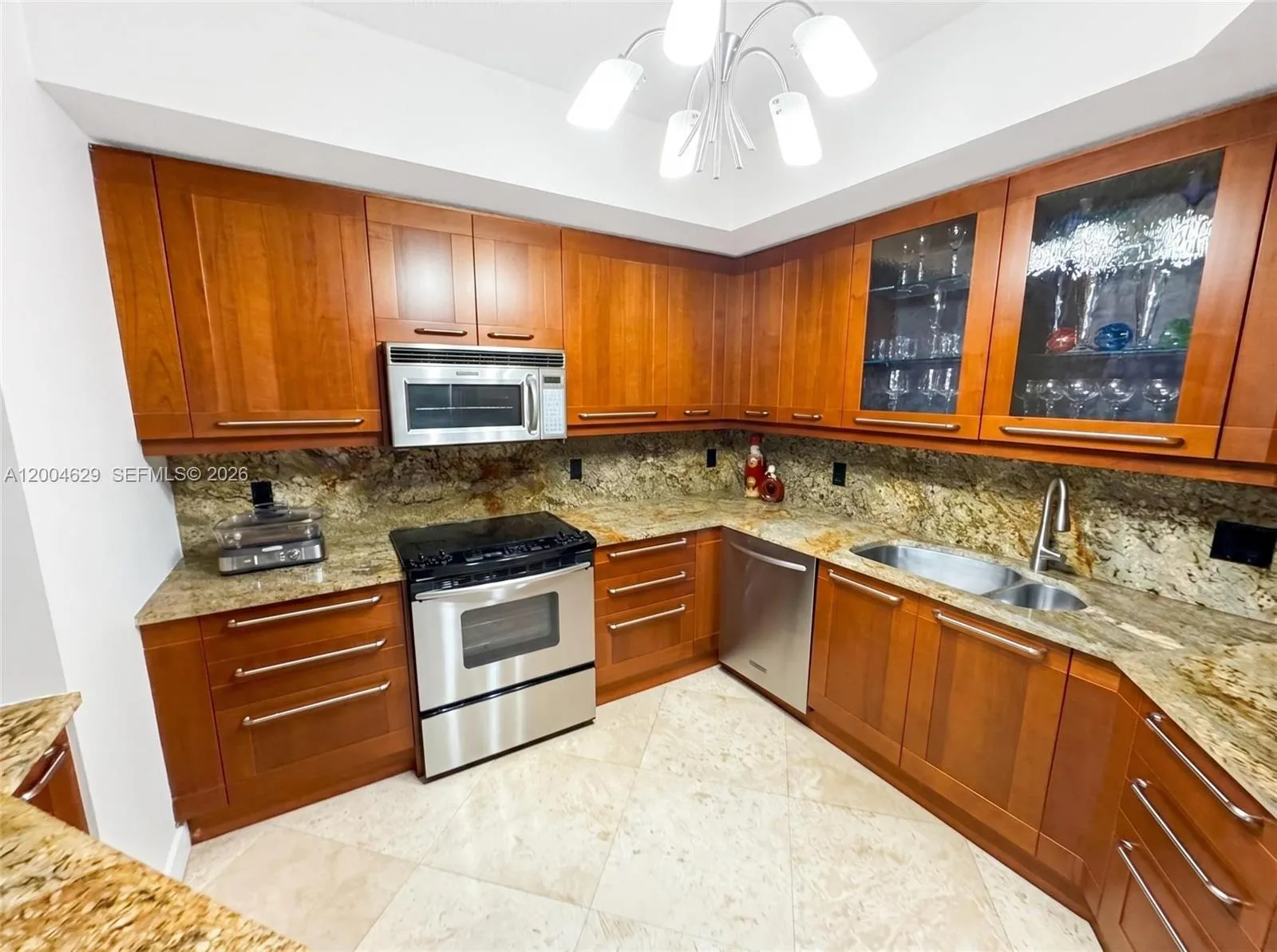 Photos have been digitally edited to show walls in white. Current walls feature venetian plaster which can easily be painted to buyer's preference.