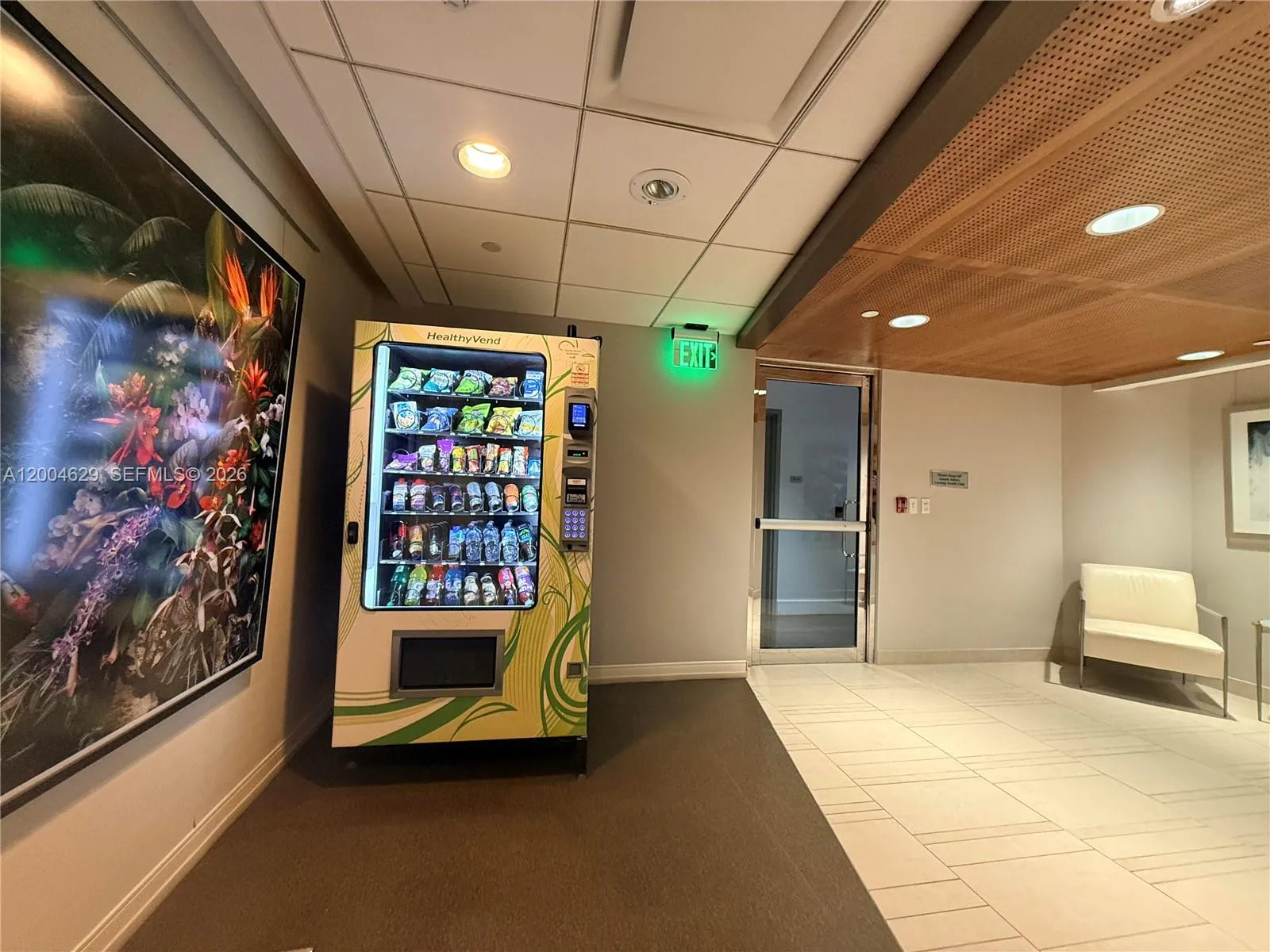 Convenient snack machine just outside the expansive 10,000 square-foot gym, perfect for a quick boost after your workout!