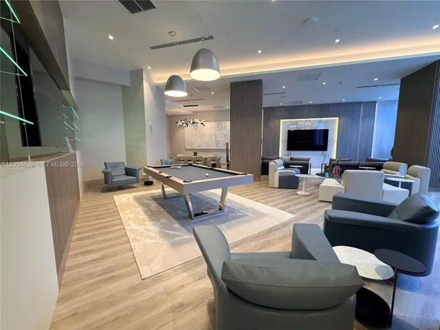 Experience luxury with newly renovated, high-end resort-style amenities, including a billiard room, library, and wine cellar.