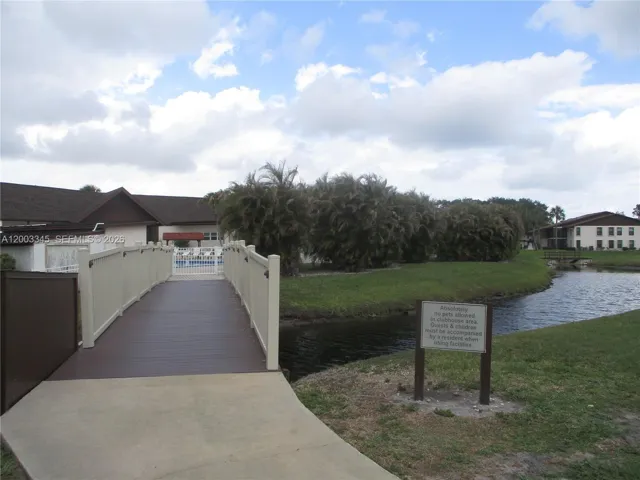 ENTRANCE TO POOL FROM S BLDG.
