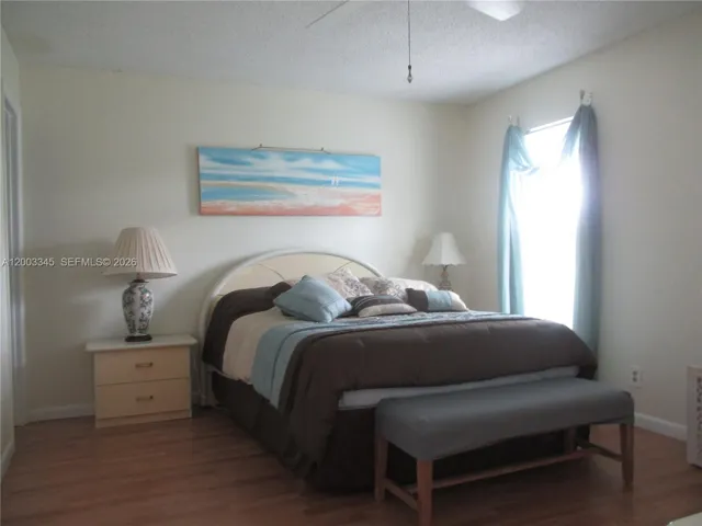 MASTER BEDROOM WITH LAMINATED FLOORING