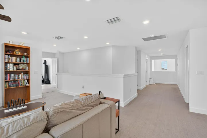 loft shows access to primary bedroom