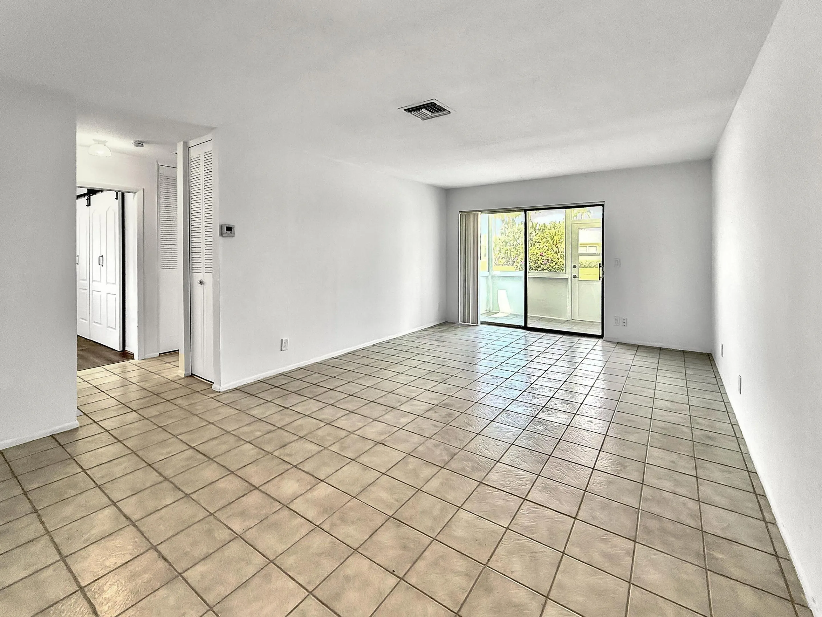 Open Living Area - Sliders lead to enclosed patio and storage