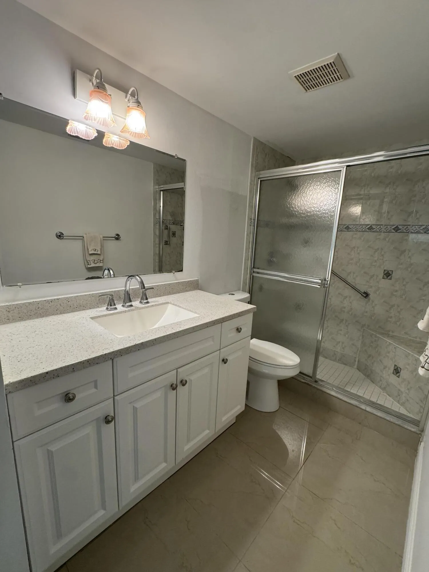 Updated bath with new lighting and mirror