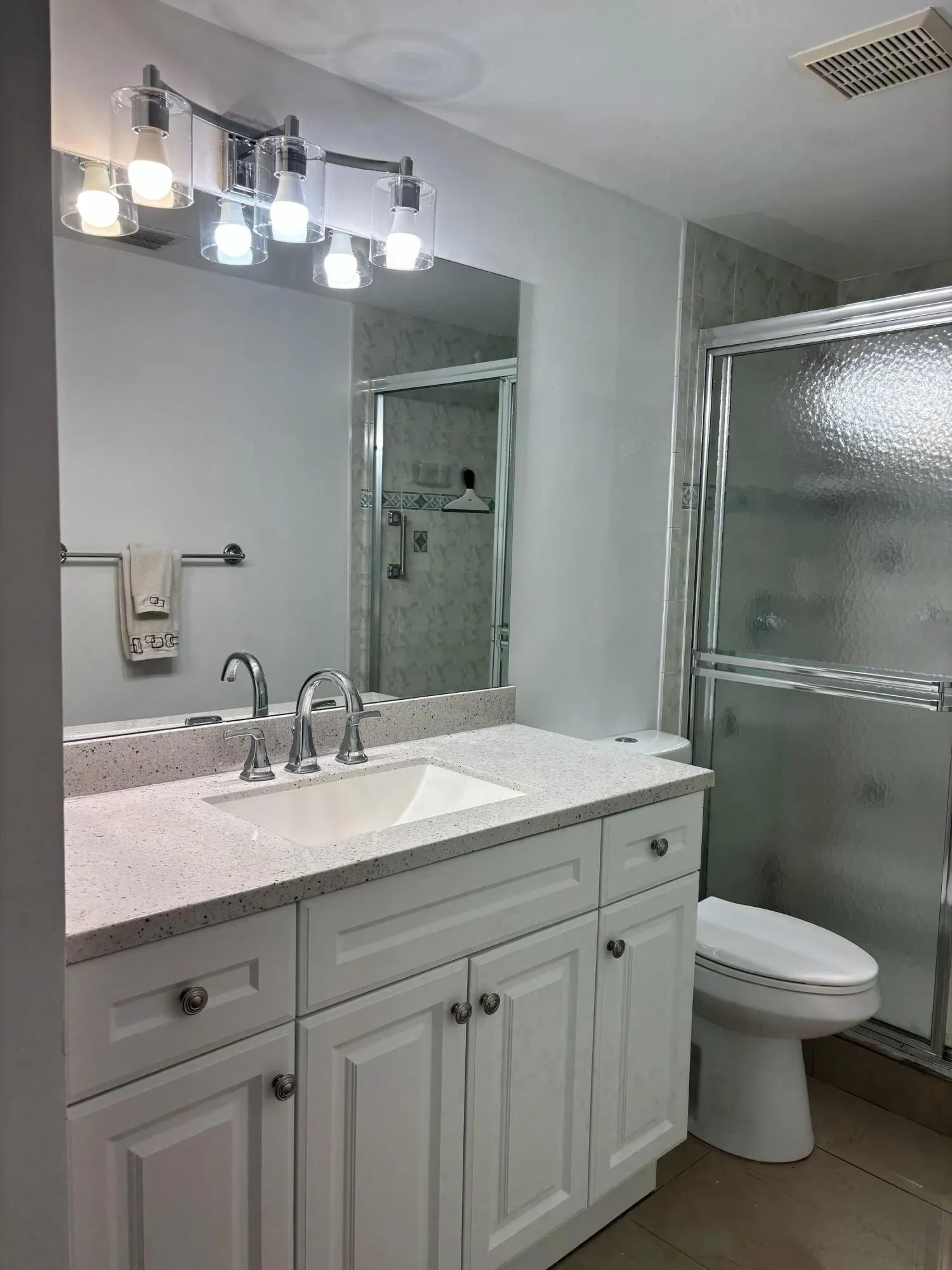 Updated bath with new lighting and mirror
