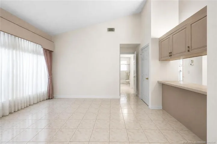 AI removal of furniture in den/easy possible 3rd bedroom.