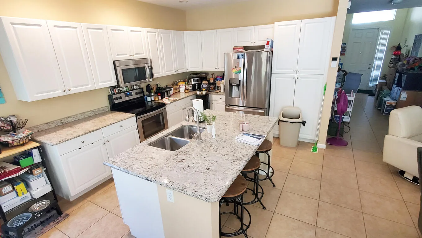 Granite countertops and stainless steel appliances.