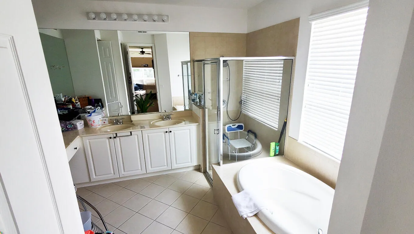 Dual sinks and a soaker tub to relax in after a rough day.