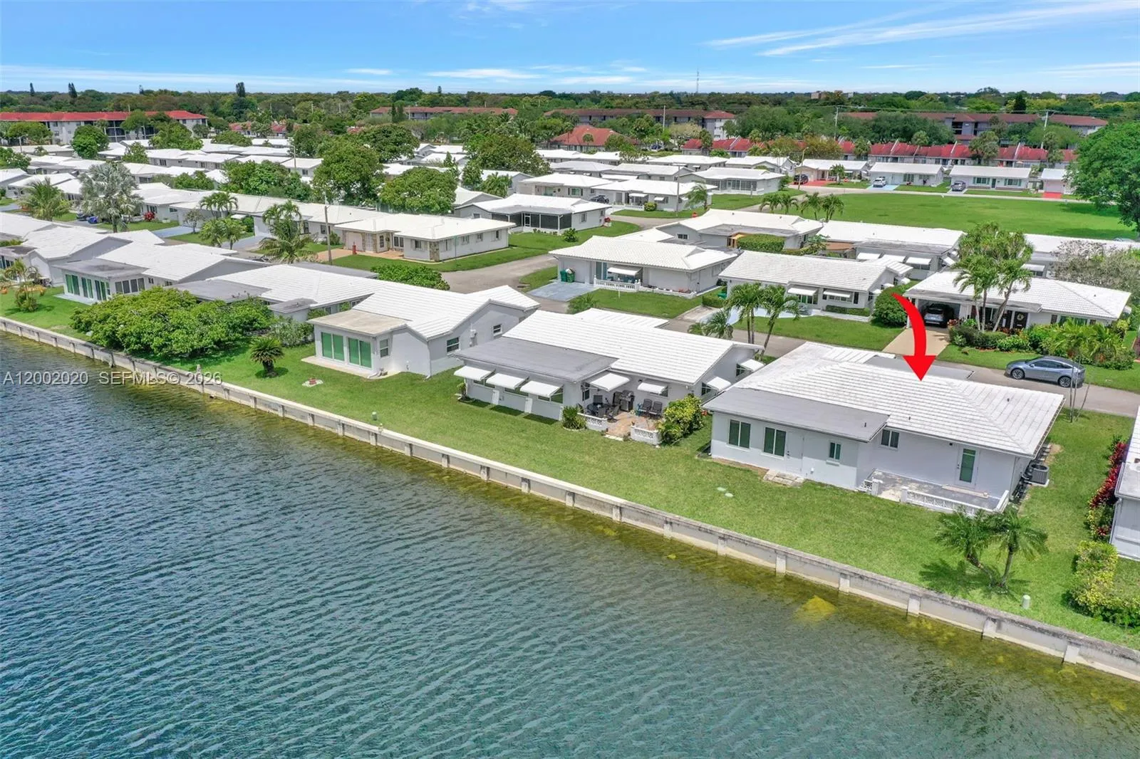 Aerial — wider community view showing water features