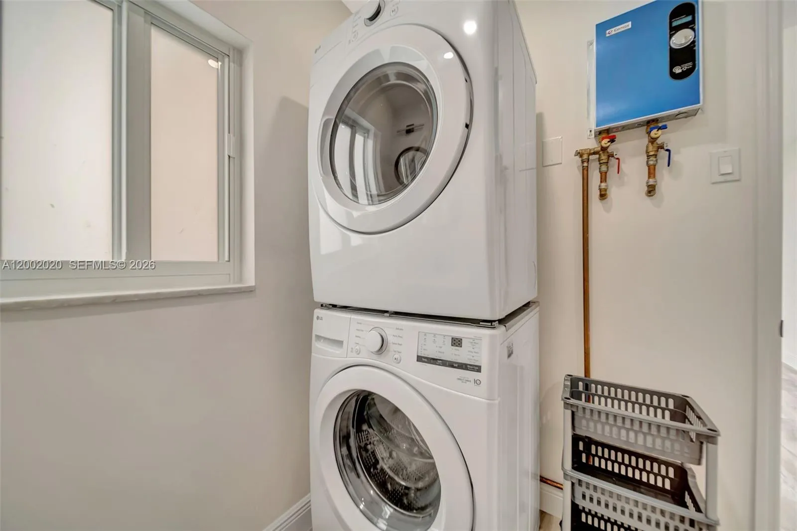 Stackable LG washer and dryer — included. New thermostatic tankless water heater