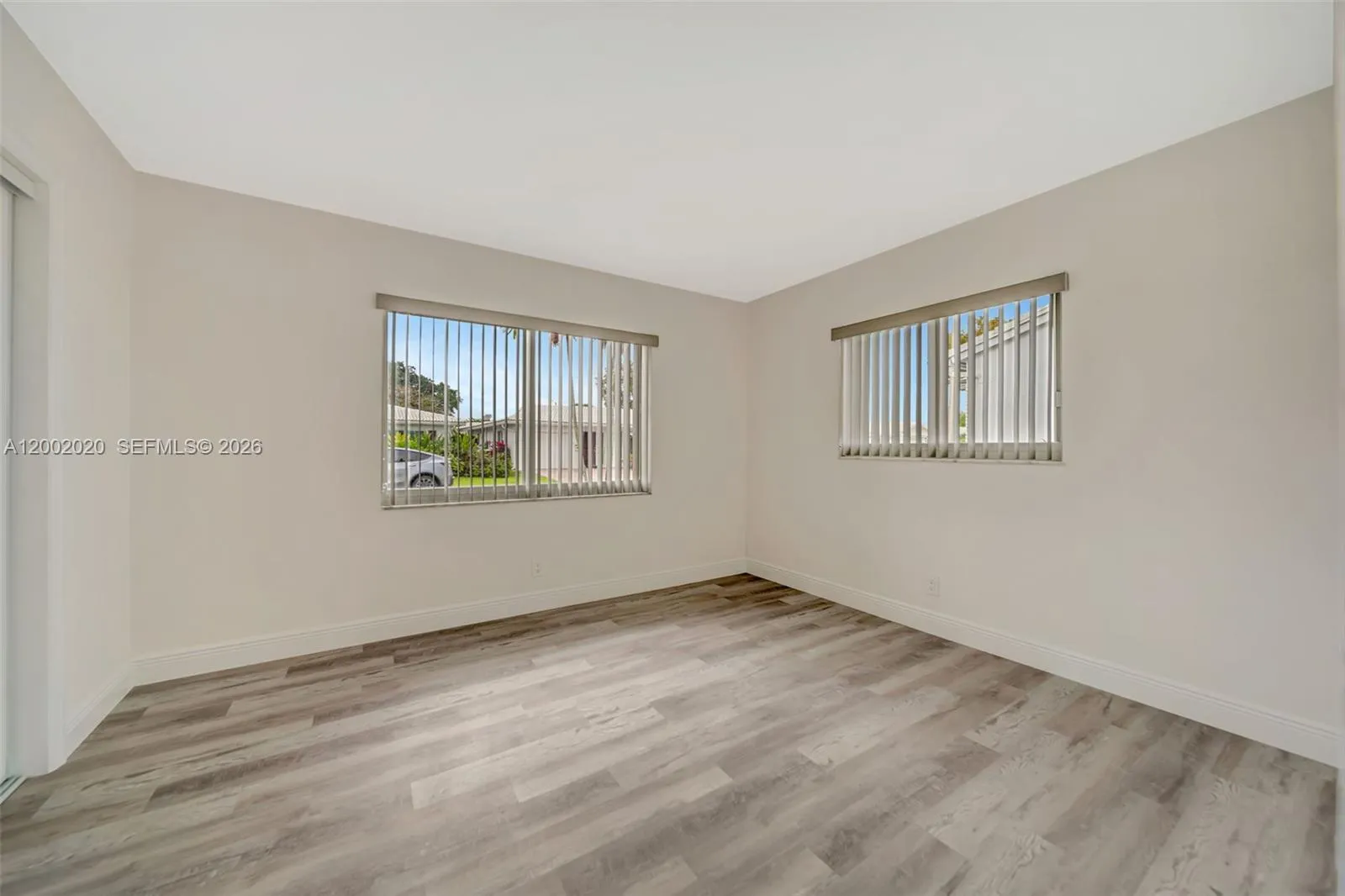 Primary bedroom with closet and natural light